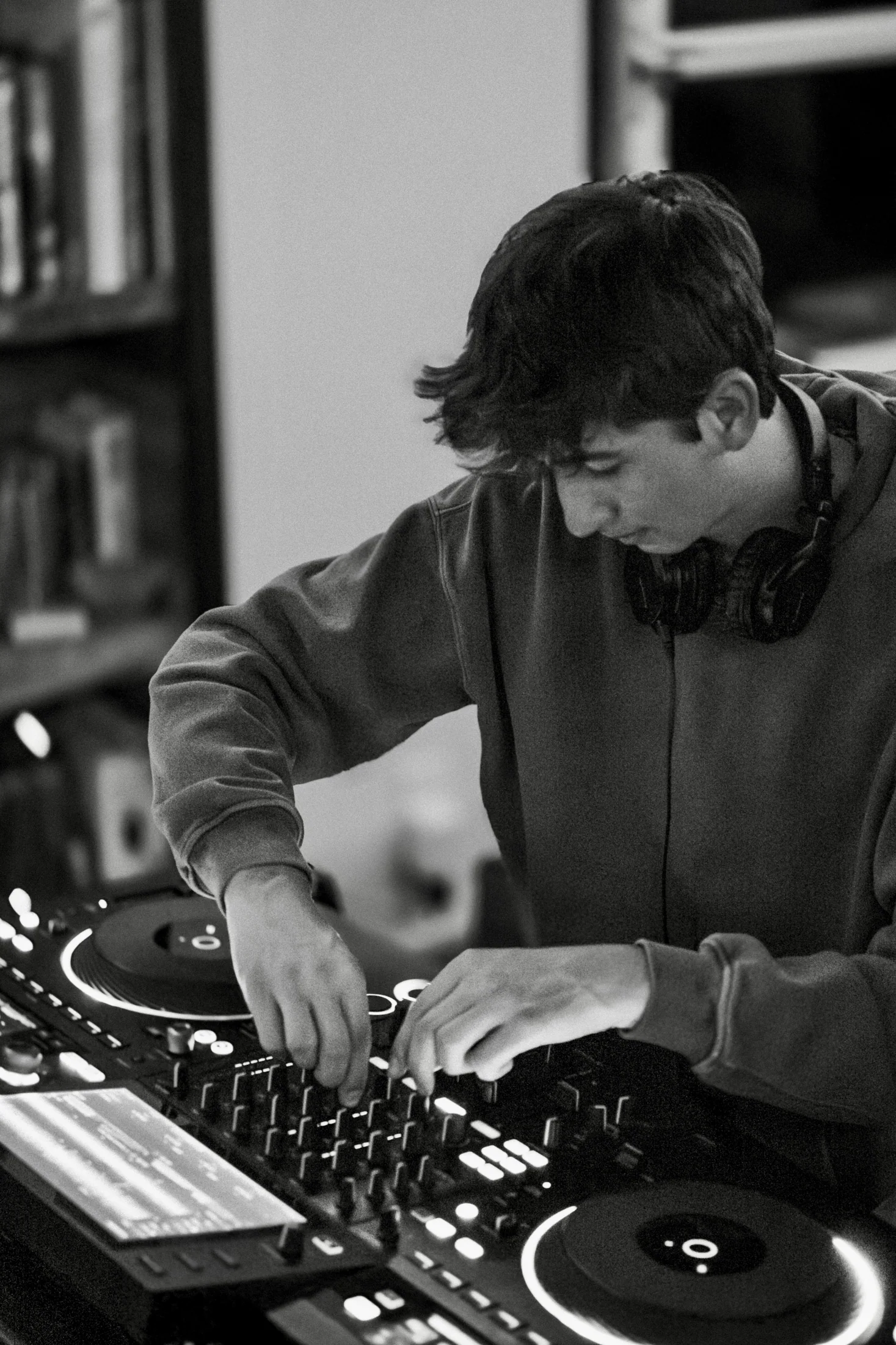 Judah mixing music at a DJ controller