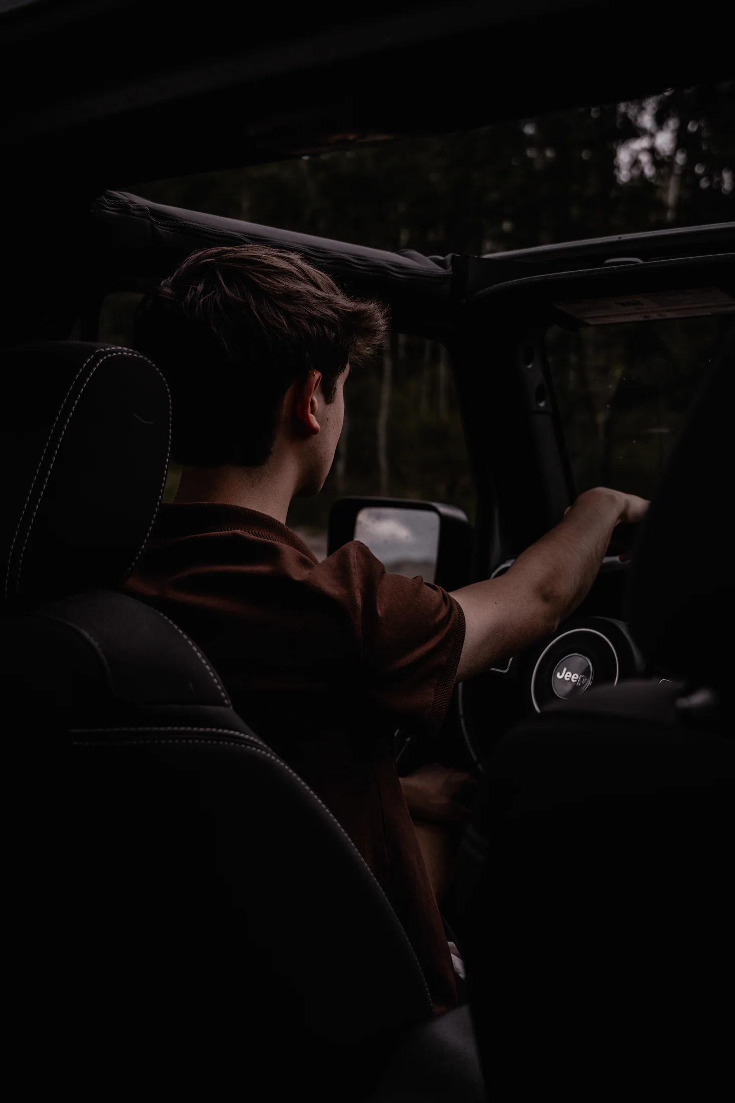 Judah driving a Jeep through the dark