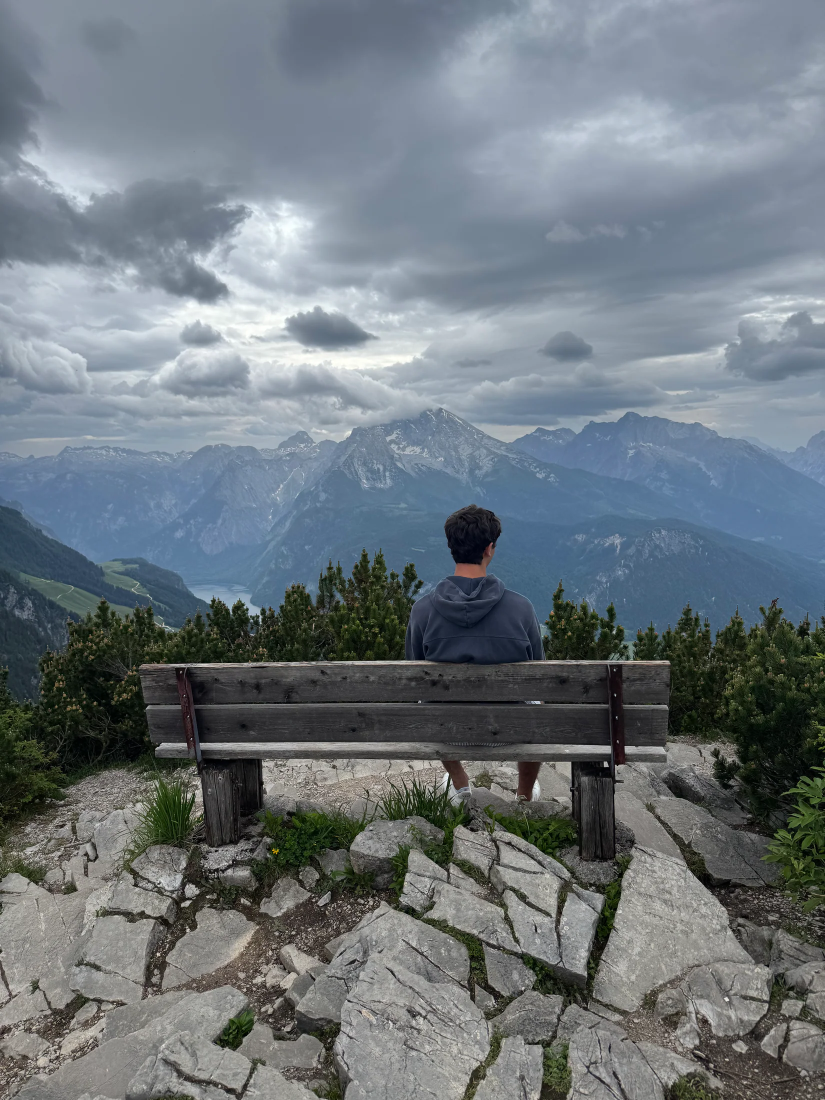 Judah sitting on a bench overlooking the mountains
