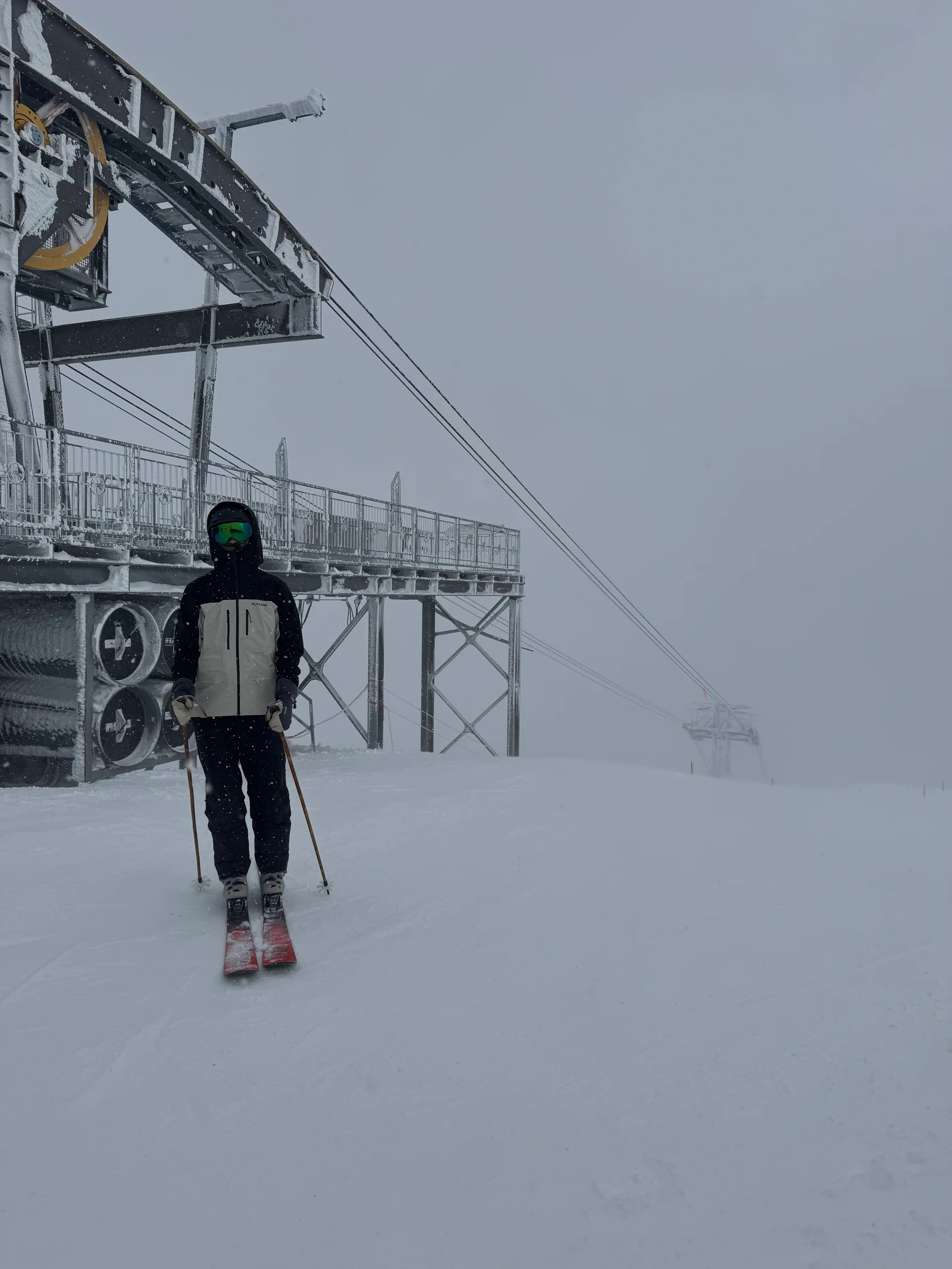Judah beneath a chairlift in a snowstorm